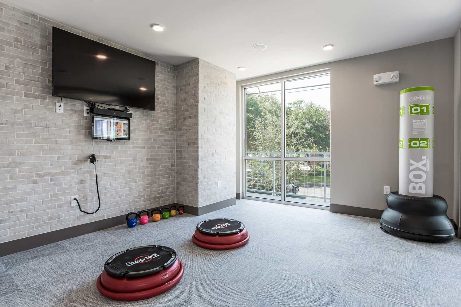 1111 Durham Drive, Unit 203 Houston, TX 77007 - Photo 15 of 15 a room with toys and a flat screen tv