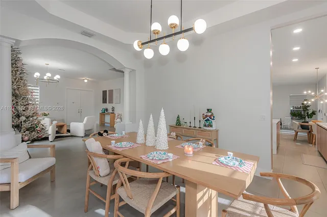 a bed room with furniture and a chandelier