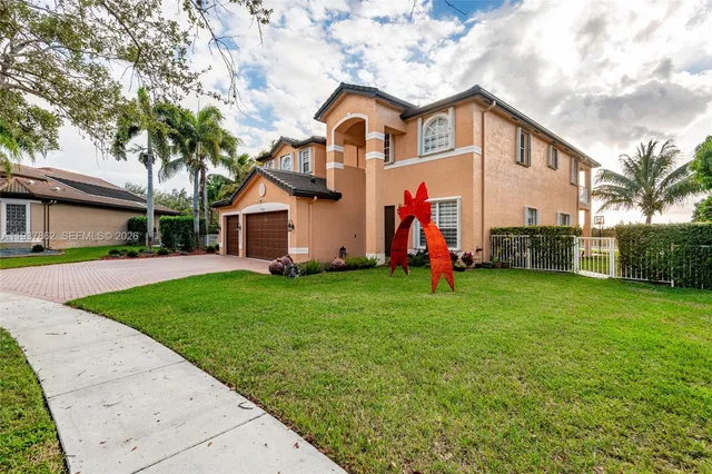 a front view of house with yard and green space