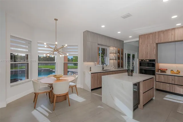 a view of a dining room with furniture window and outside view