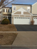 1530 Glacier Trail Carpentersville, IL 60110 - Photo 1 of 24 a view of a building with a street