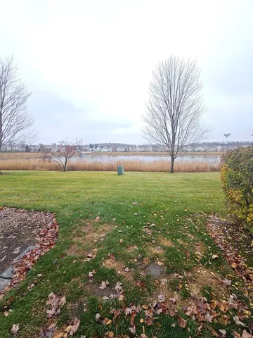 a view of a field with an ocean view