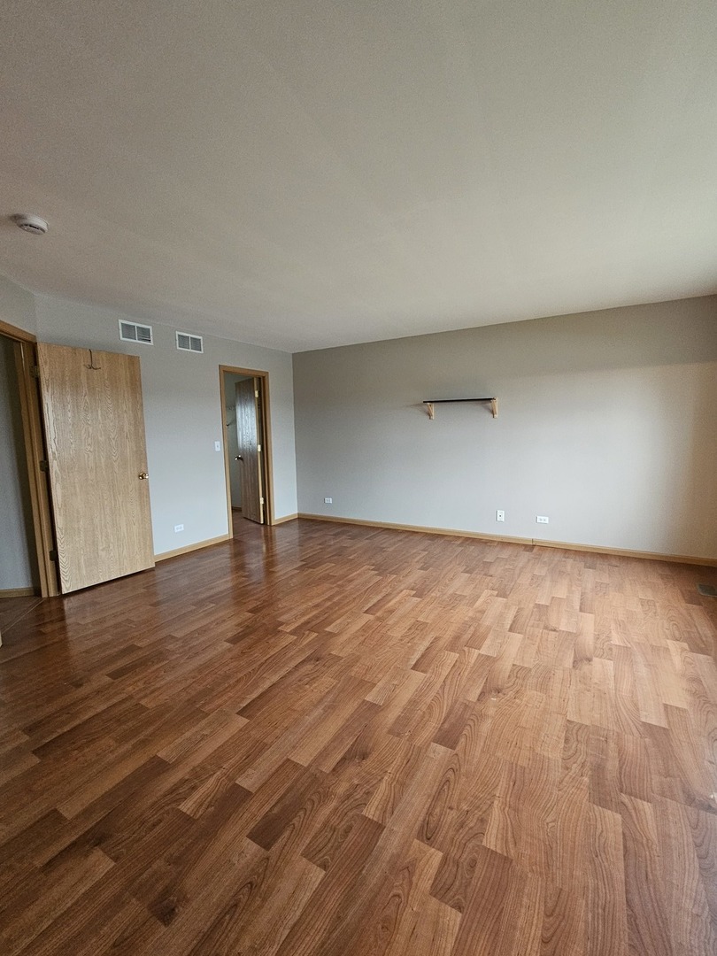 1530 Glacier Trail Carpentersville, IL 60110 - Photo 18 of 24 a view of an empty room and wooden floor