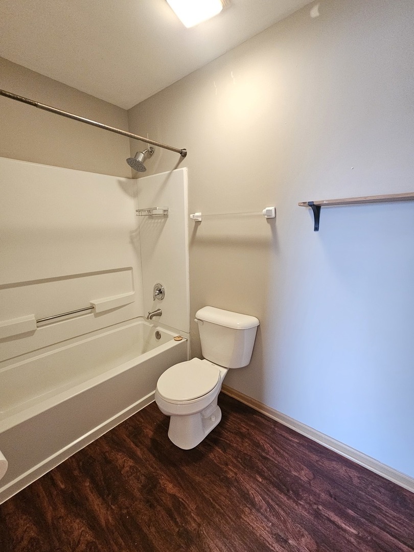 1530 Glacier Trail Carpentersville, IL 60110 - Photo 22 of 24 a bathroom with a toilet and a shower