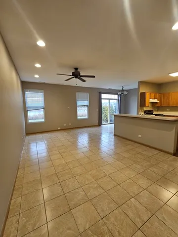 a view of a kitchen with a sink and cabinets