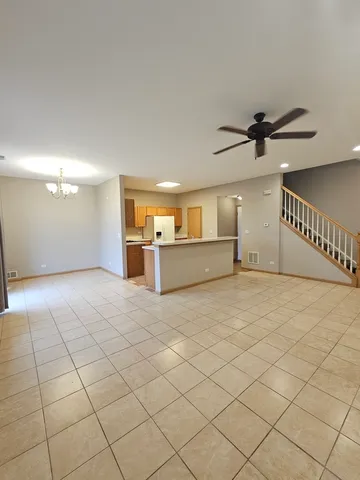 a view of a livingroom with a furniture and a ceiling fan