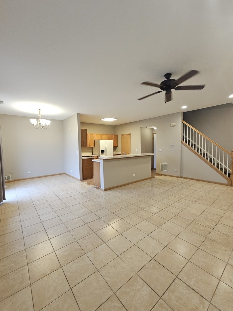 1530 Glacier Trail Carpentersville, IL 60110 - Photo 7 of 24 a view of a livingroom with a furniture and a ceiling fan