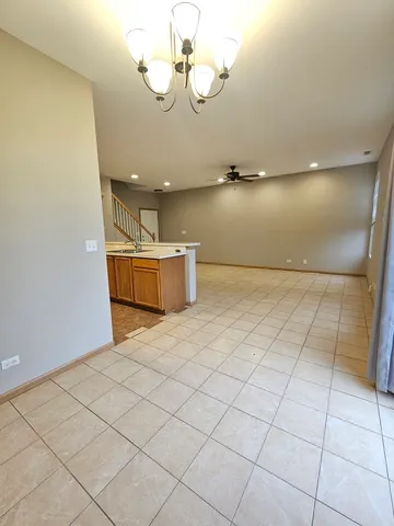 a view of a room with a projector and fan