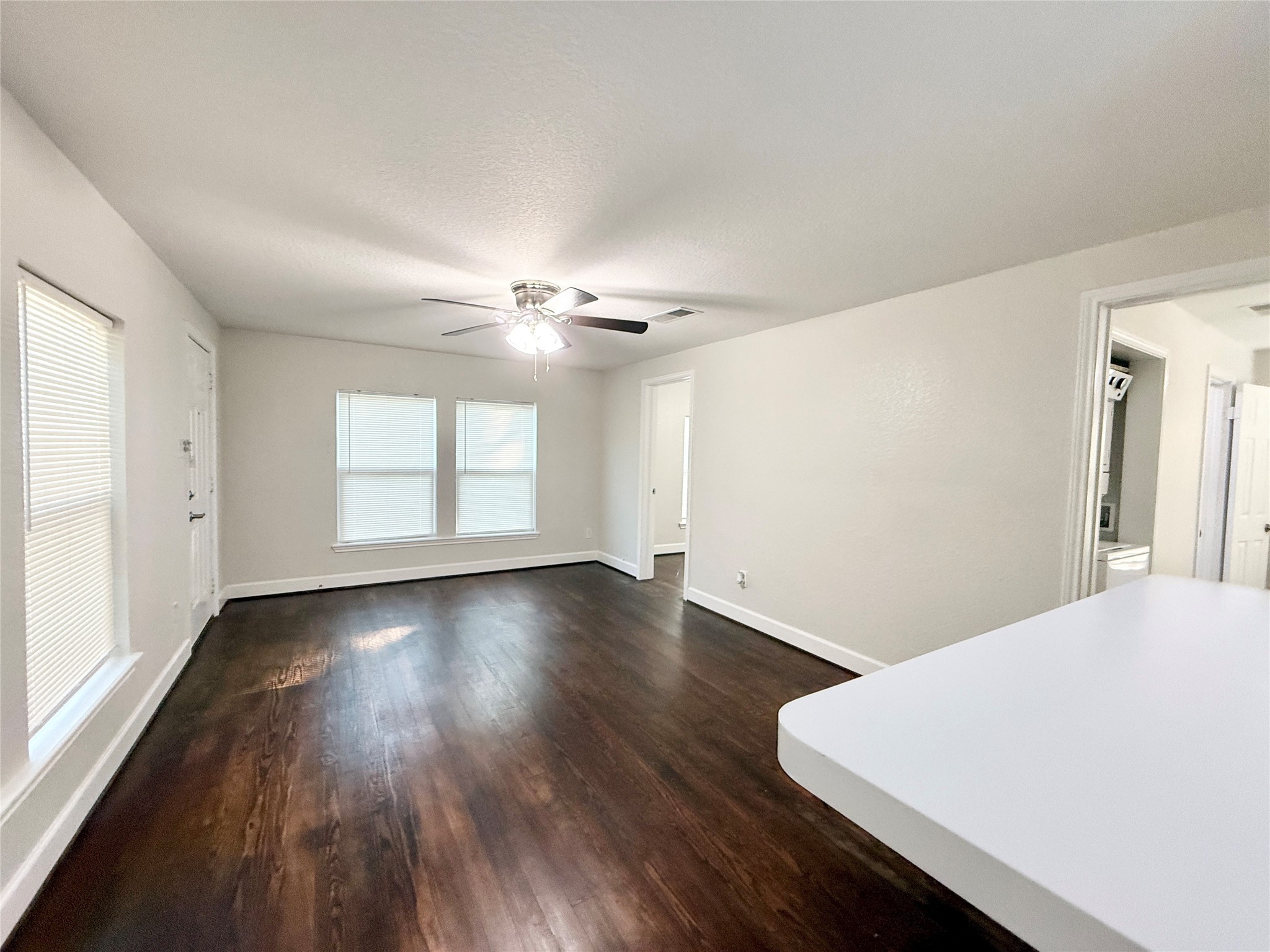 620 East Magnolia Street Angleton, TX 77515 - Photo 6 of 20 a view of a livingroom with wooden floor