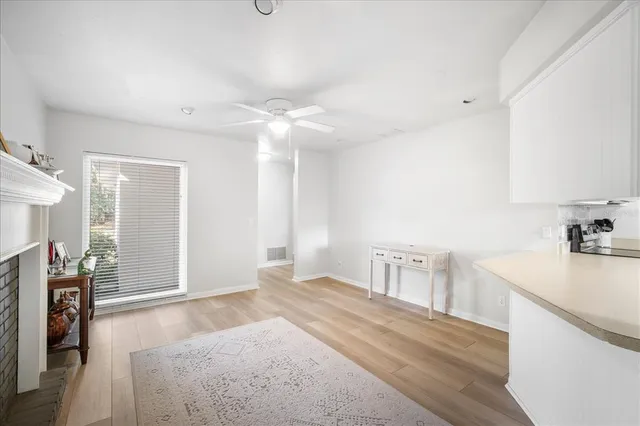 a bedroom with a bed and a view of kitchen