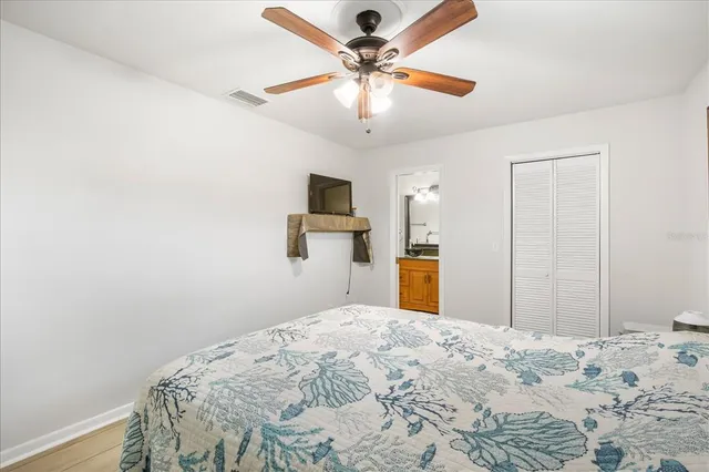 a bedroom with bed and window