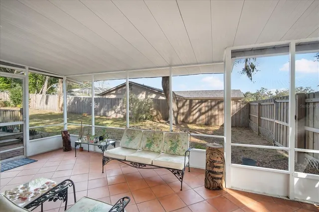 a room with lots of furniture and a chandelier
