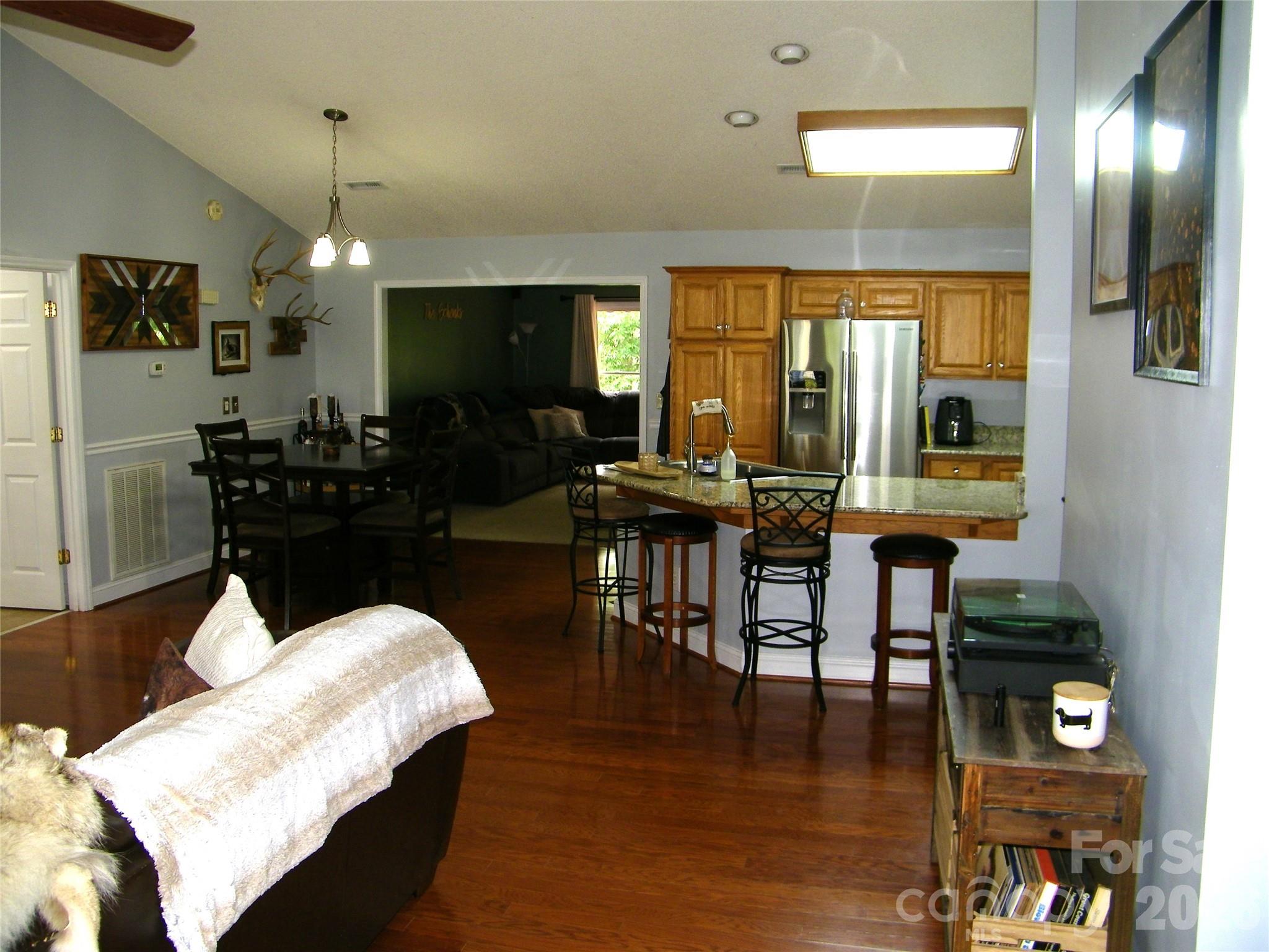 609 Redah Avenue Locust, NC 28097 - Photo 7 of 37 a living room with furniture and a flat screen tv