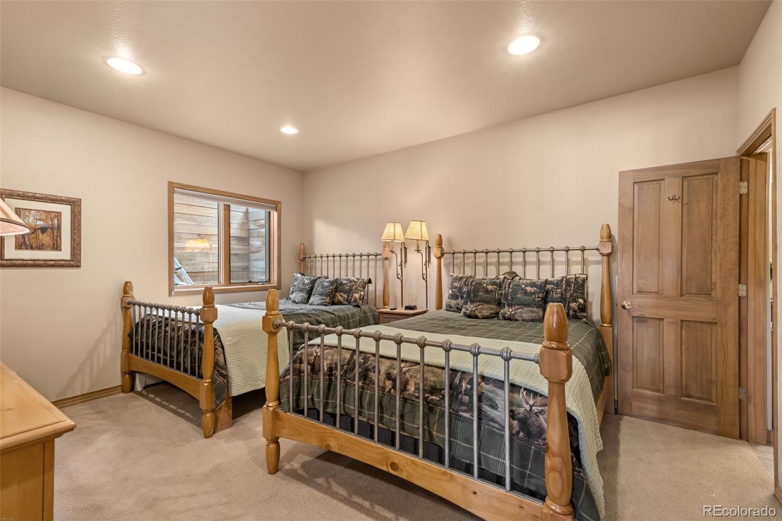 92 Emmett Lode Road, Unit B Breckenridge, CO 80424 - Photo 29 of 50 a bedroom with furniture and a window