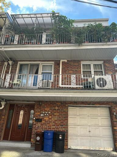 a front view of house with large windows