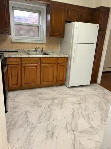 a view of a kitchen with a sink