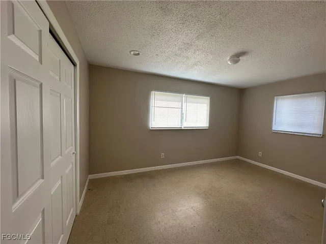 an empty room with windows