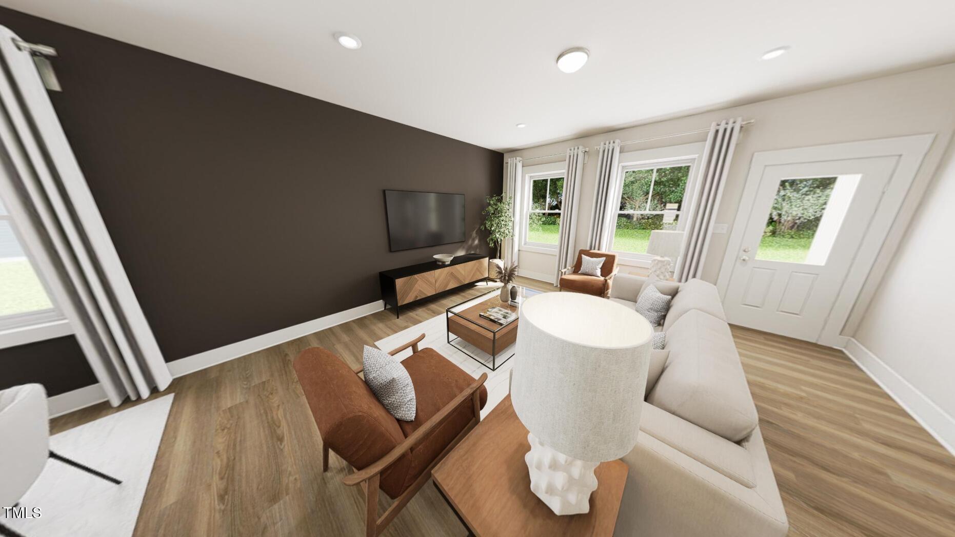 320 Beacon Drive Pittsboro, NC 27312 - Photo 9 of 22 a living room with furniture and a flat screen tv