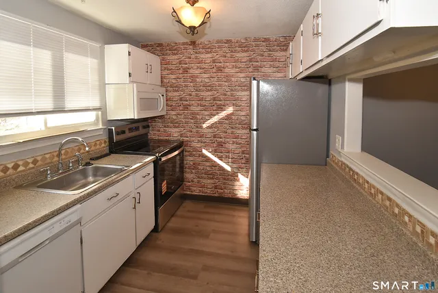 a bathroom with a sink and a window