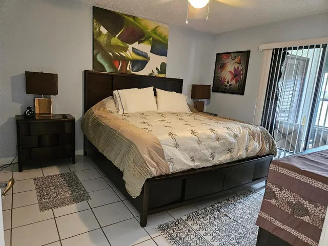a bedroom with a bed and dresser