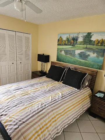 a bedroom with a bed and sky view