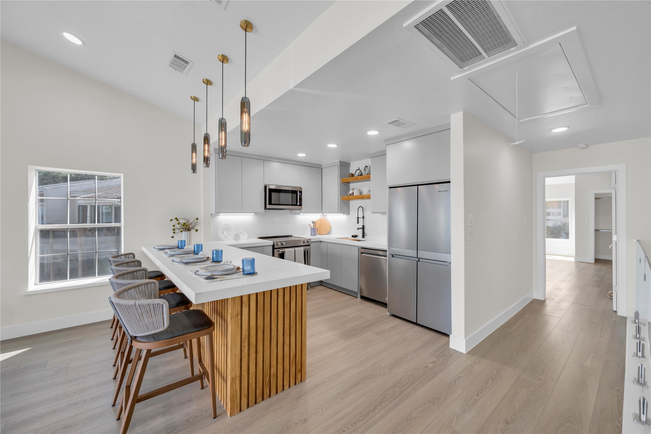 30 Regency Montgomery, TX 77356 - Photo 19 of 47 a dinning room and kitchen with a wooden floor