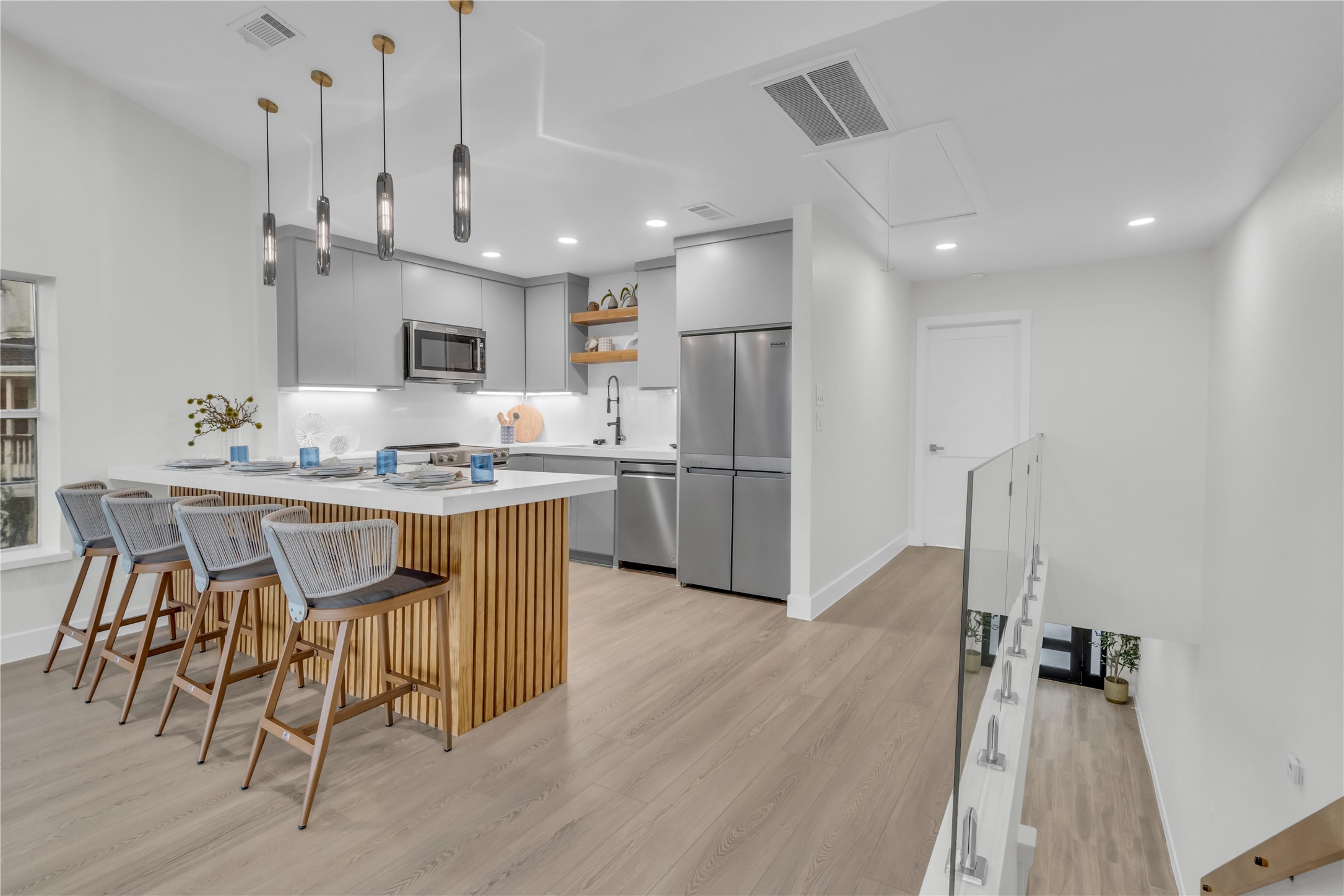 30 Regency Montgomery, TX 77356 - Photo 20 of 47 a kitchen with kitchen island granite countertop a sink cabinets and stainless steel appliances