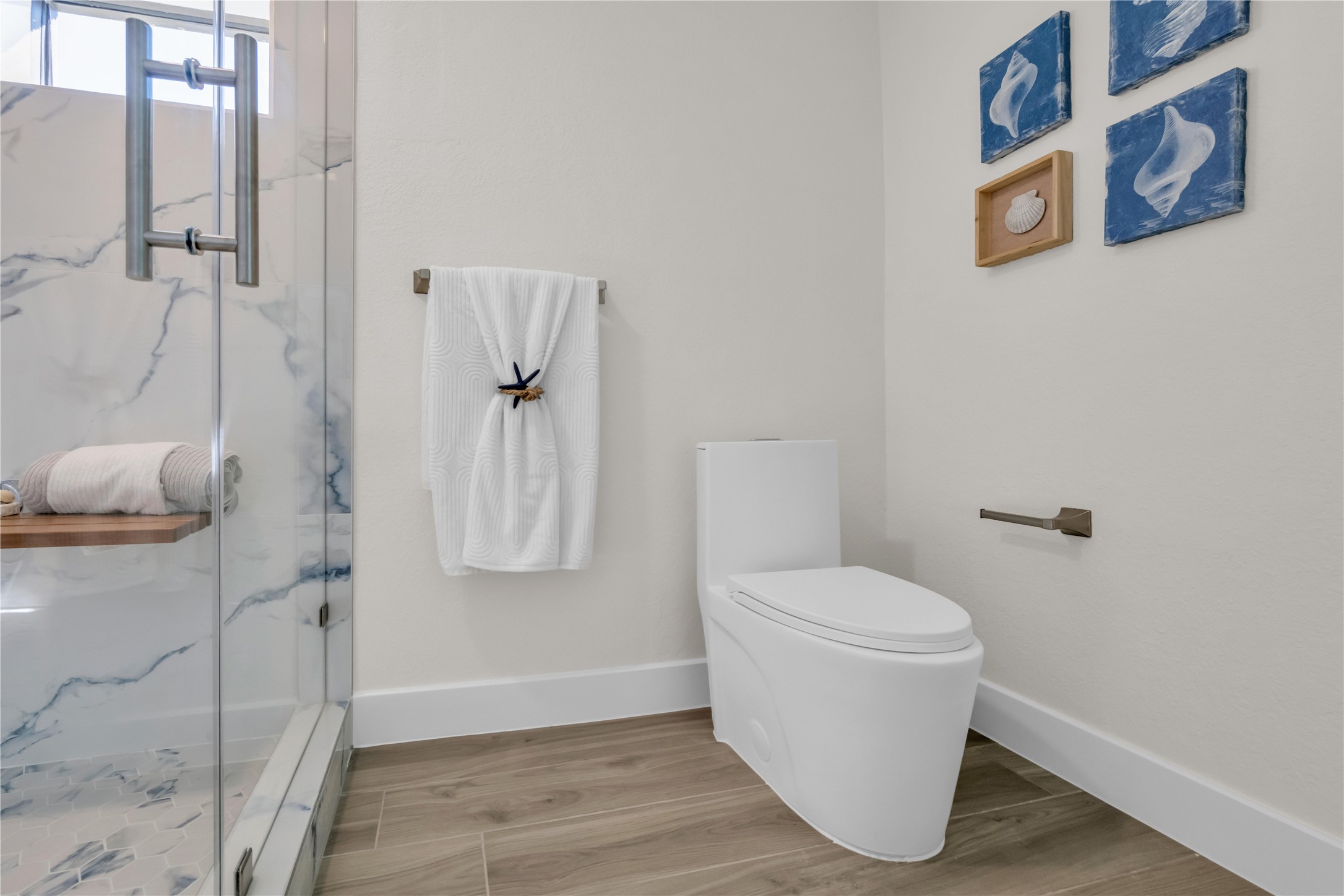 30 Regency Montgomery, TX 77356 - Photo 31 of 47 a white toilet sitting next to a bathroom sink