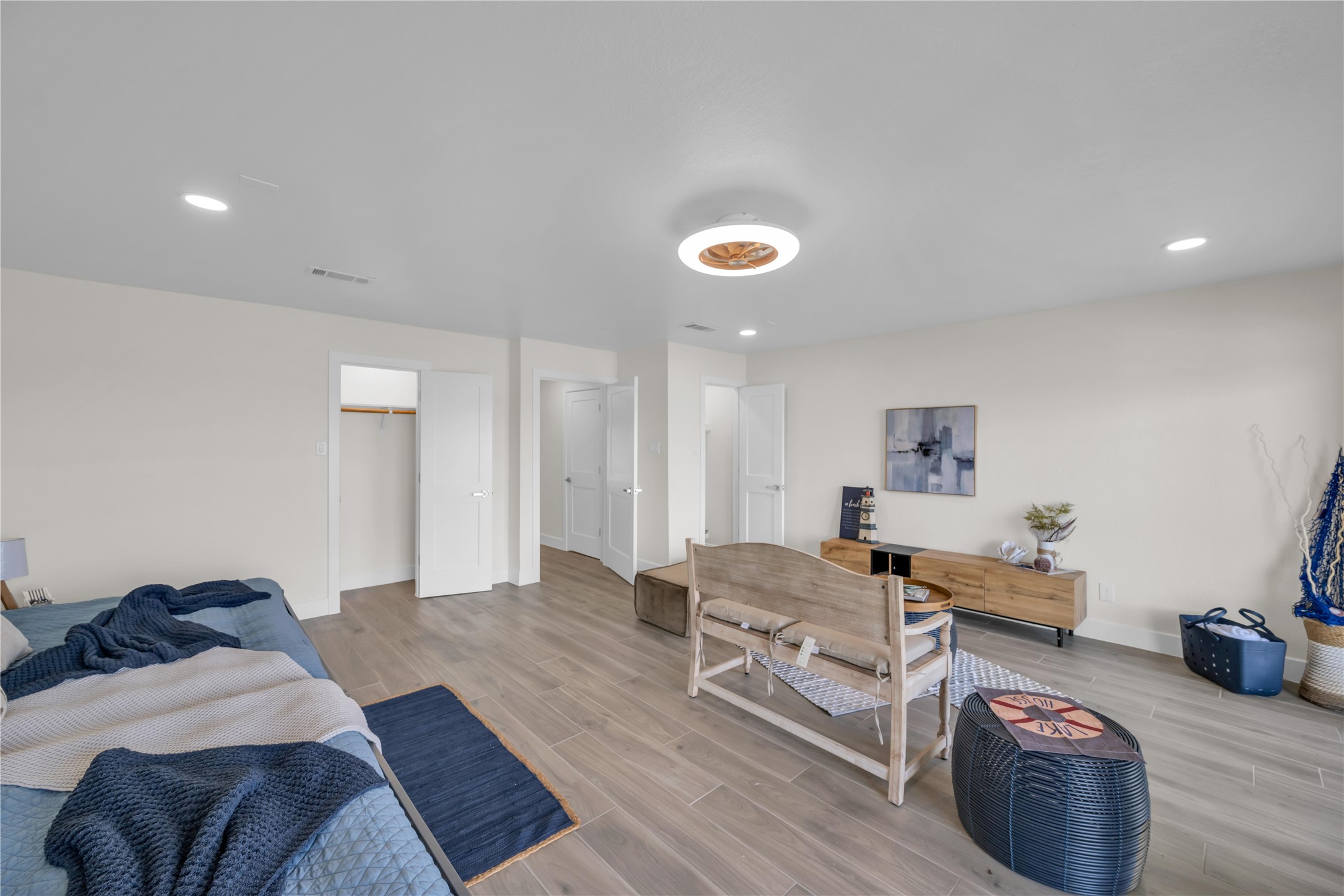 30 Regency Montgomery, TX 77356 - Photo 37 of 47 a bedroom with furniture and a wooden floor