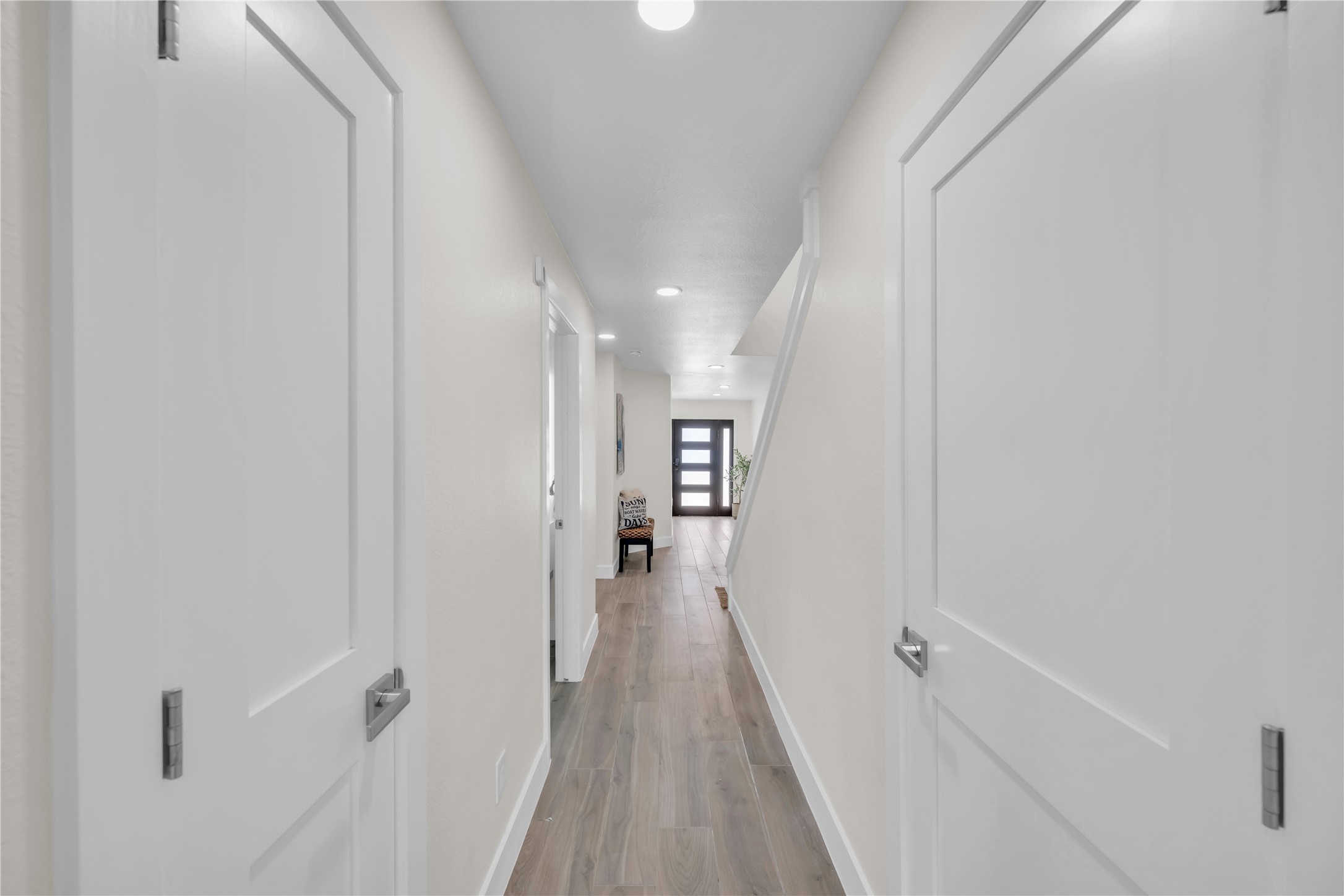 30 Regency Montgomery, TX 77356 - Photo 39 of 47 a view of a hallway with wooden floor and a bathroom