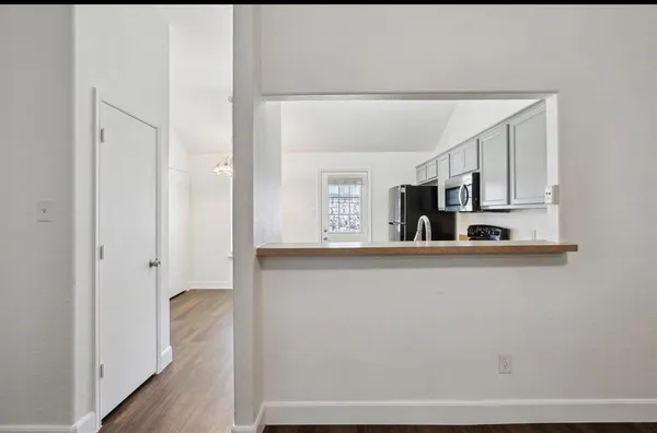 a view of cabinets with wooden floor