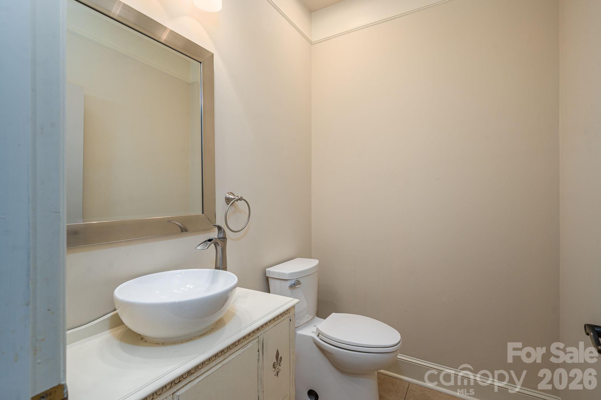 208 Hollow Road Lincolnton, NC 28092 - Photo 16 of 48 a bathroom with a granite countertop toilet and a sink