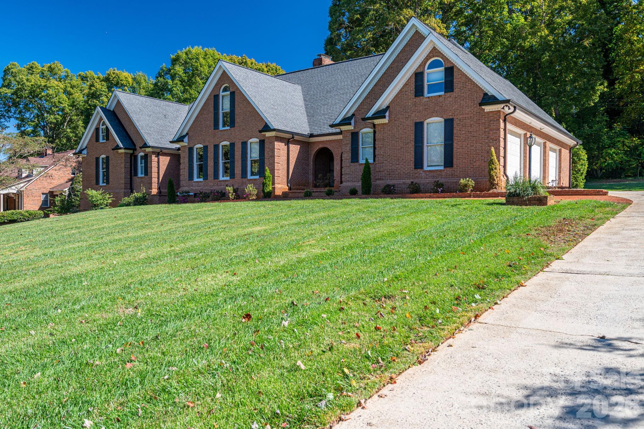208 Hollow Road Lincolnton, NC 28092 - Photo 2 of 48 a front view of a house with a garden and porch
