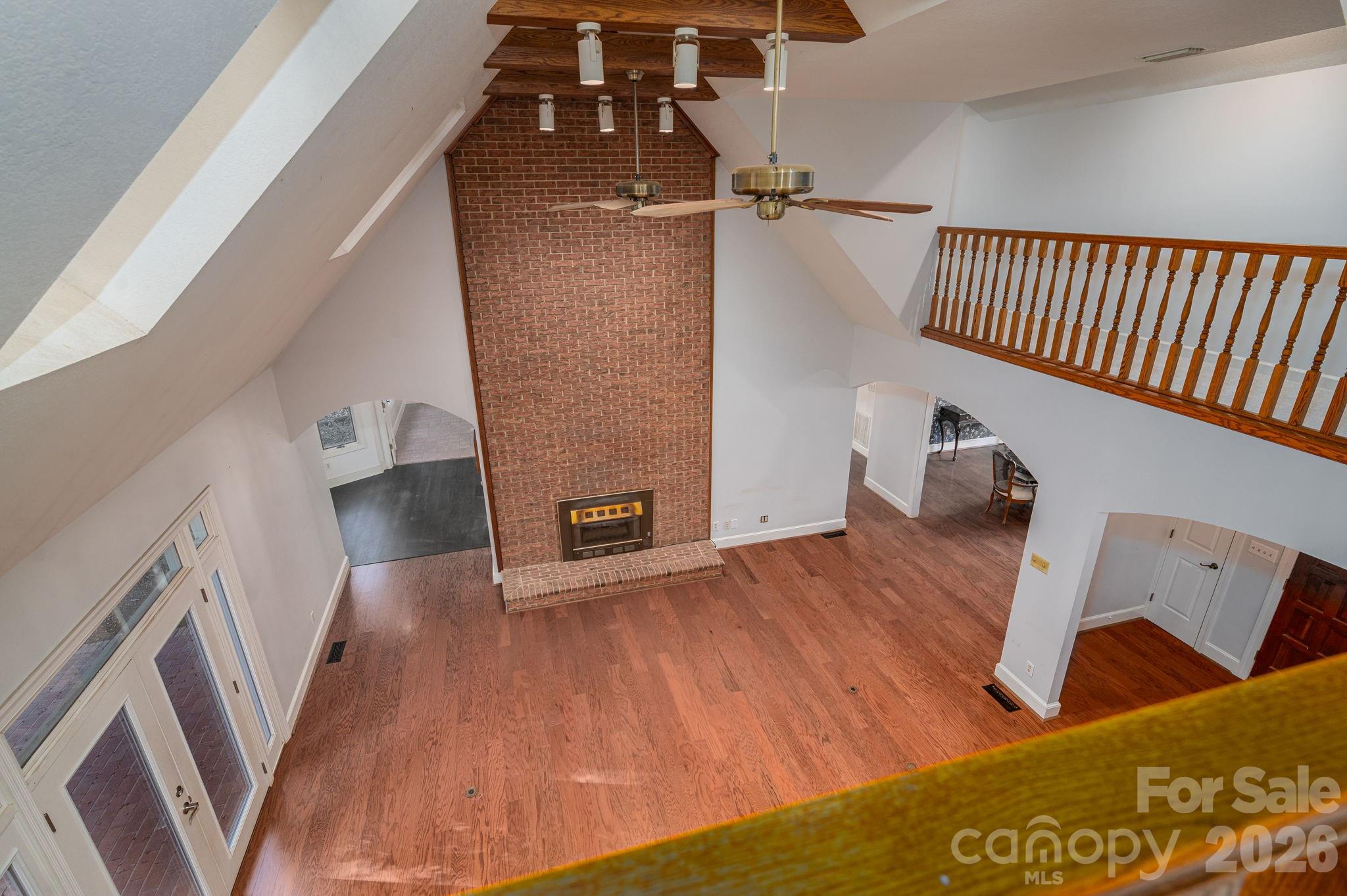 208 Hollow Road Lincolnton, NC 28092 - Photo 26 of 48 a view of a living room with furniture and wooden floor