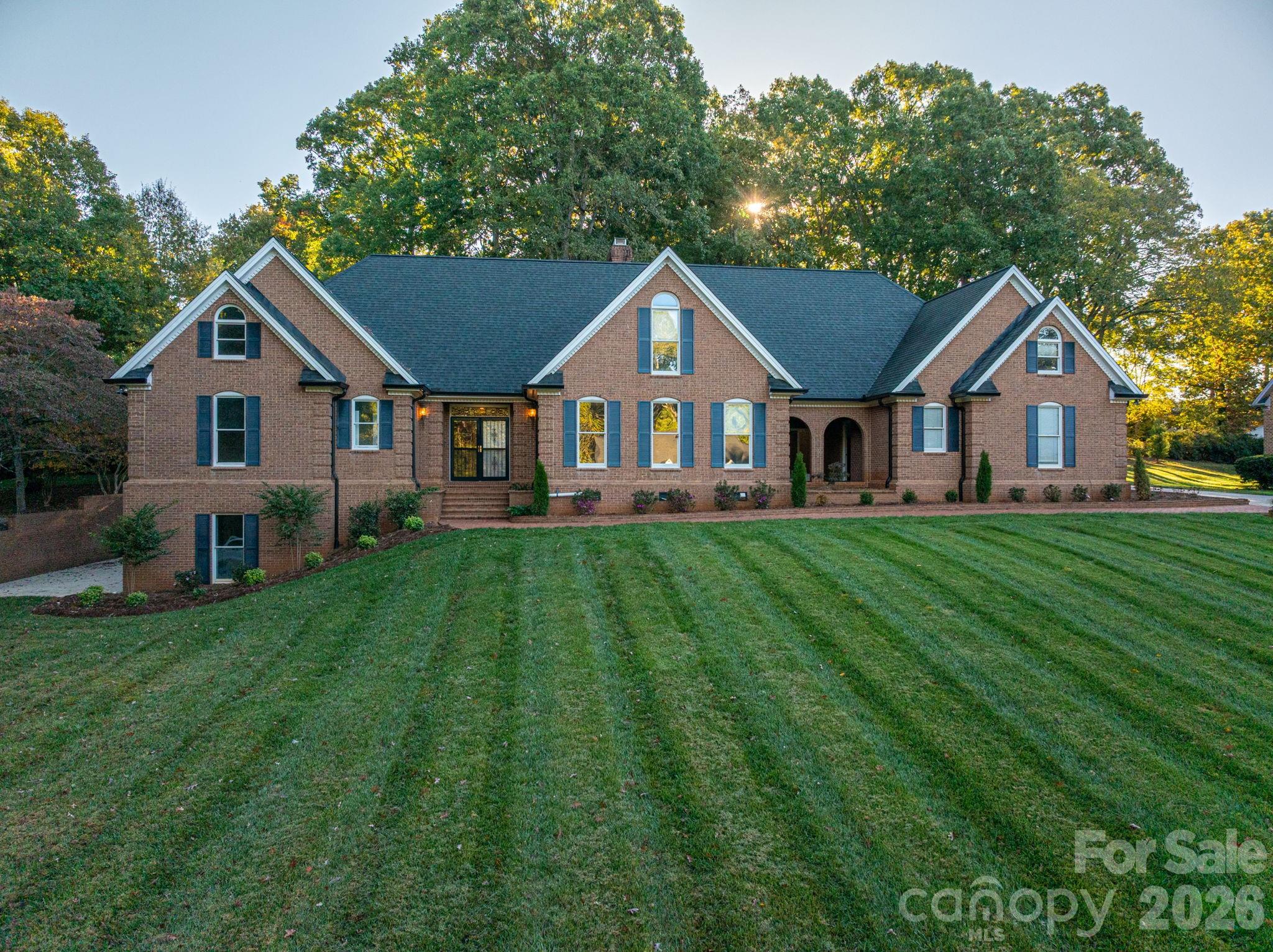 208 Hollow Road Lincolnton, NC 28092 - Photo 3 of 48 a front view of a house with a yard and trees