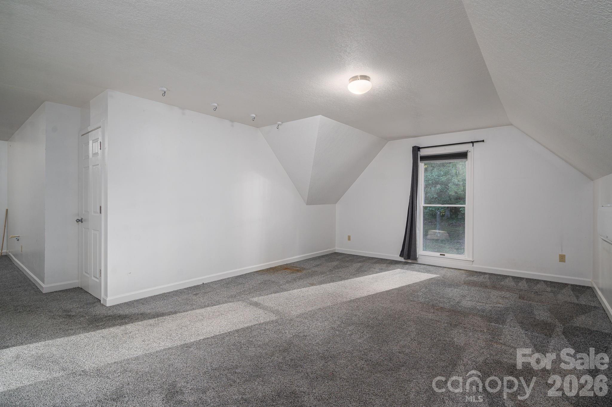 208 Hollow Road Lincolnton, NC 28092 - Photo 38 of 48 an empty room with windows