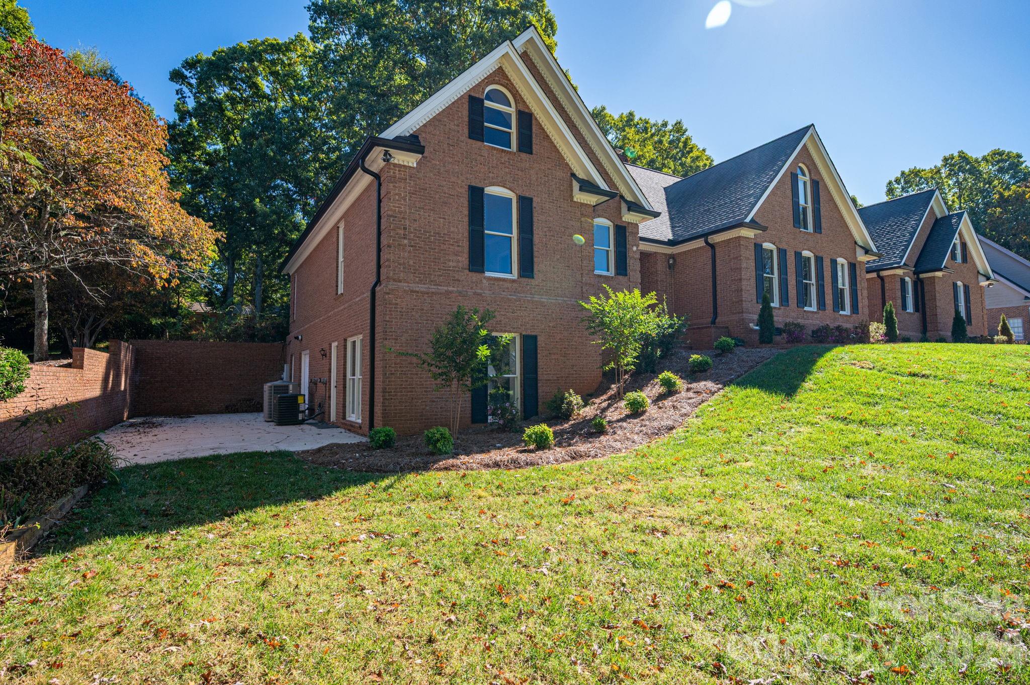208 Hollow Road Lincolnton, NC 28092 - Photo 48 of 48 a front view of a house with a yard and garage