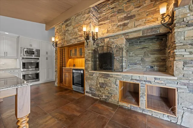 a kitchen with stainless steel appliances granite countertop a stove and a sink