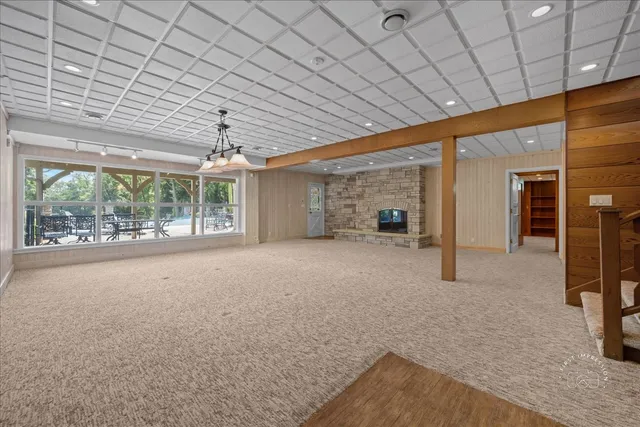 a view of a livingroom with an empty space and balcony