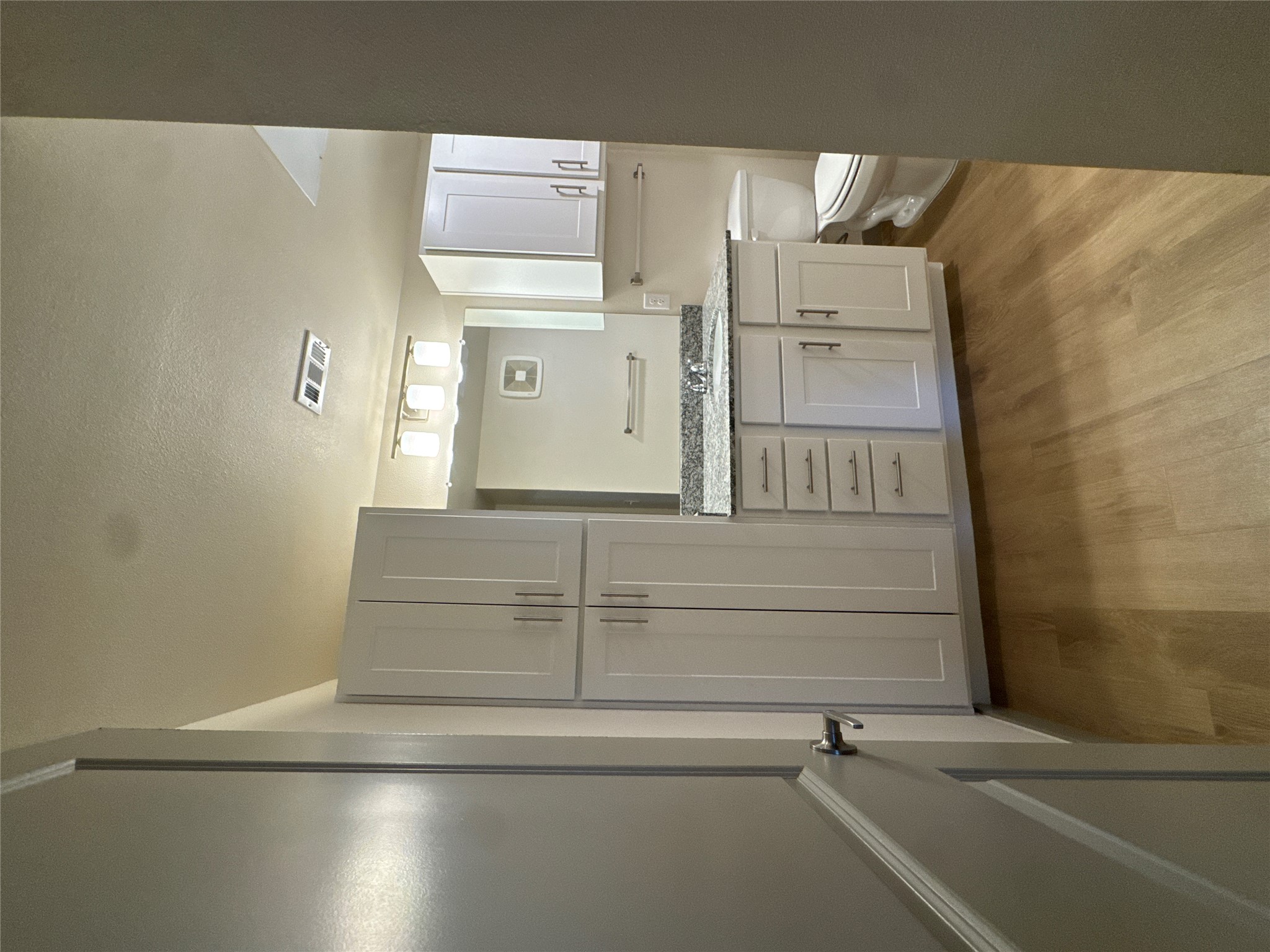 691 Union Chapel Road, Unit B1 Cedar Creek, TX 78612 - Photo 17 of 28 Bathroom featuring vanity and light wood-style flooring