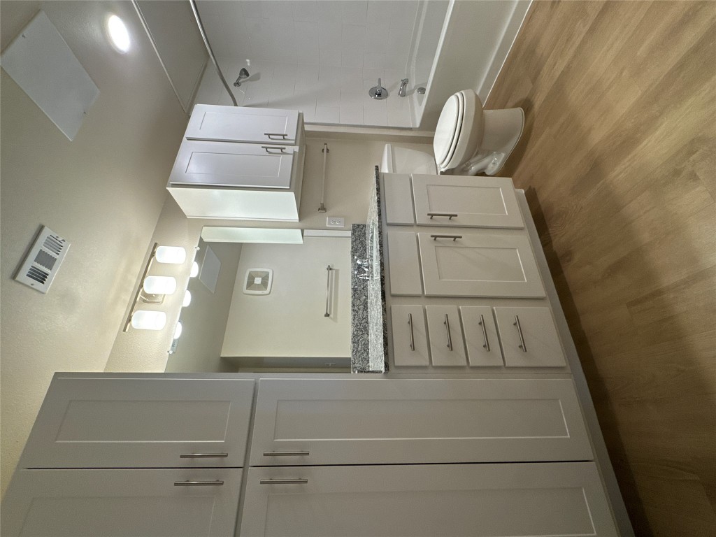 691 Union Chapel Road, Unit B1 Cedar Creek, TX 78612 - Photo 18 of 28 Full bath featuring vanity, light wood-style flooring, and bathtub / shower combination