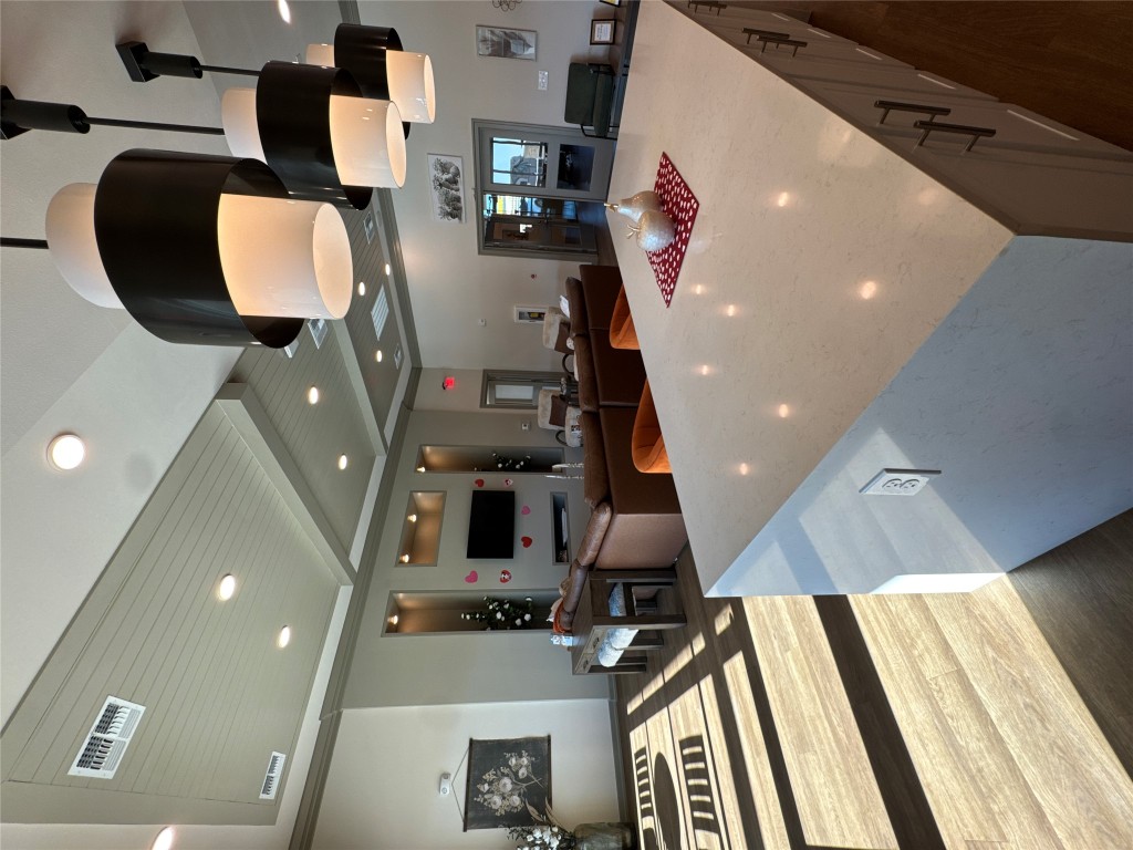 691 Union Chapel Road, Unit B1 Cedar Creek, TX 78612 - Photo 28 of 28 Kitchen featuring beam ceiling, open floor plan, light stone countertops, recessed lighting, and pendant lighting