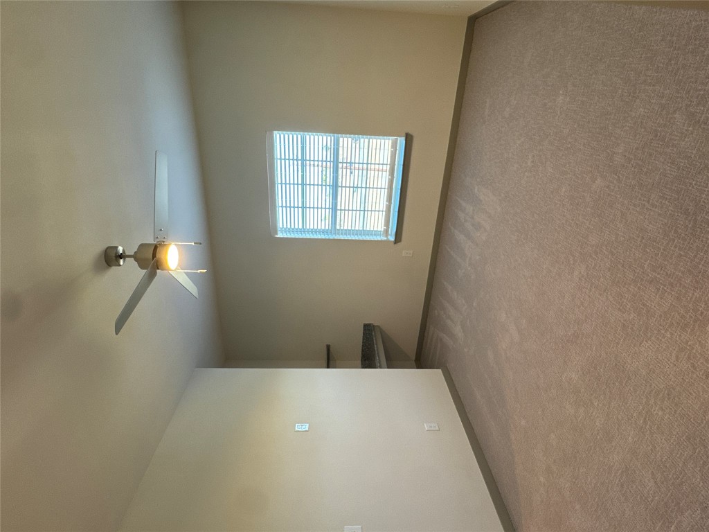 691 Union Chapel Road, Unit B1 Cedar Creek, TX 78612 - Photo 9 of 28 Carpeted spare room with baseboards and ceiling fan