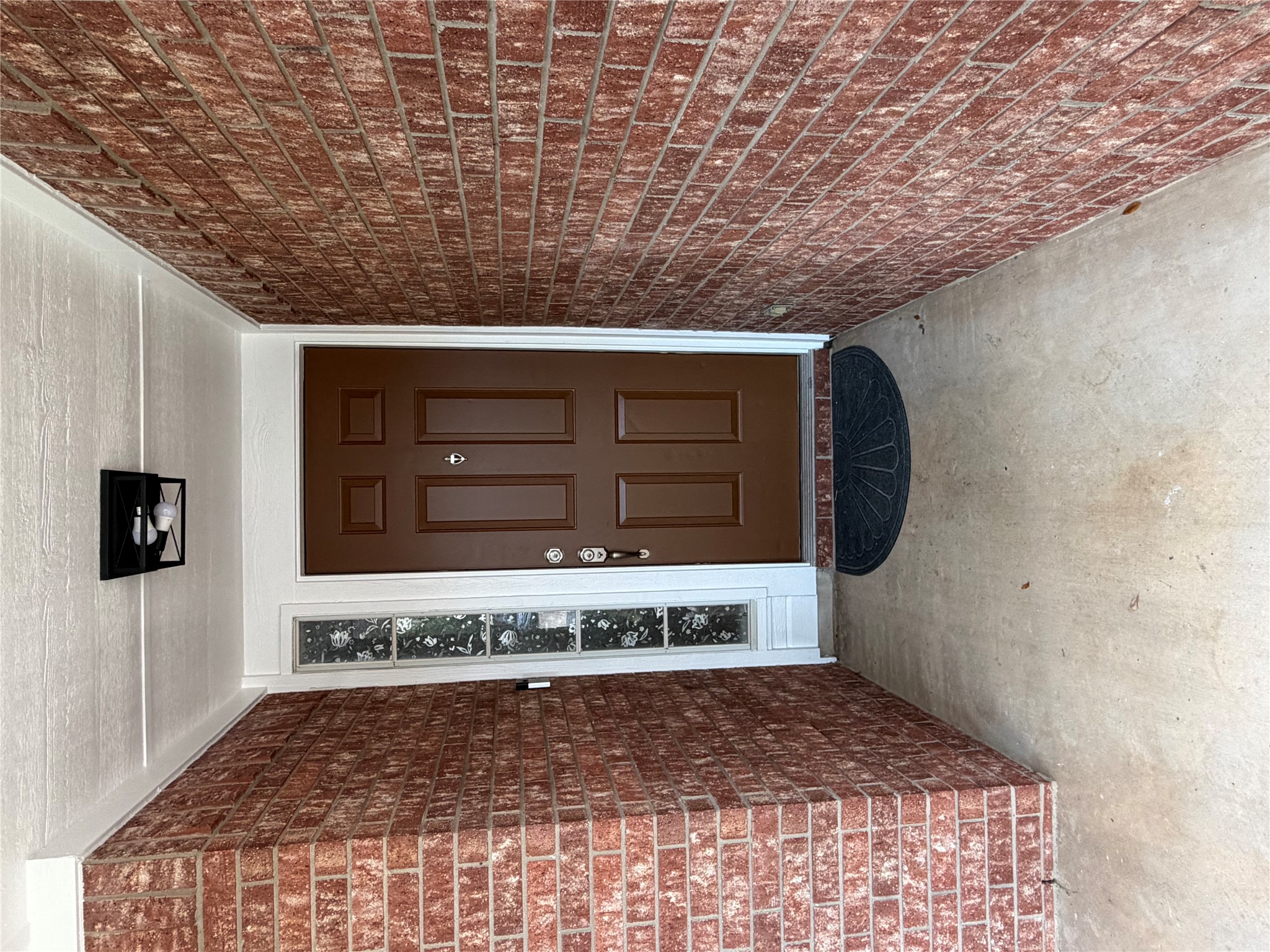 4604 Ramies Run Austin, TX 78749 - Photo 4 of 38 A covered concrete entryway is flanked by classic brick walls leading to the front door.