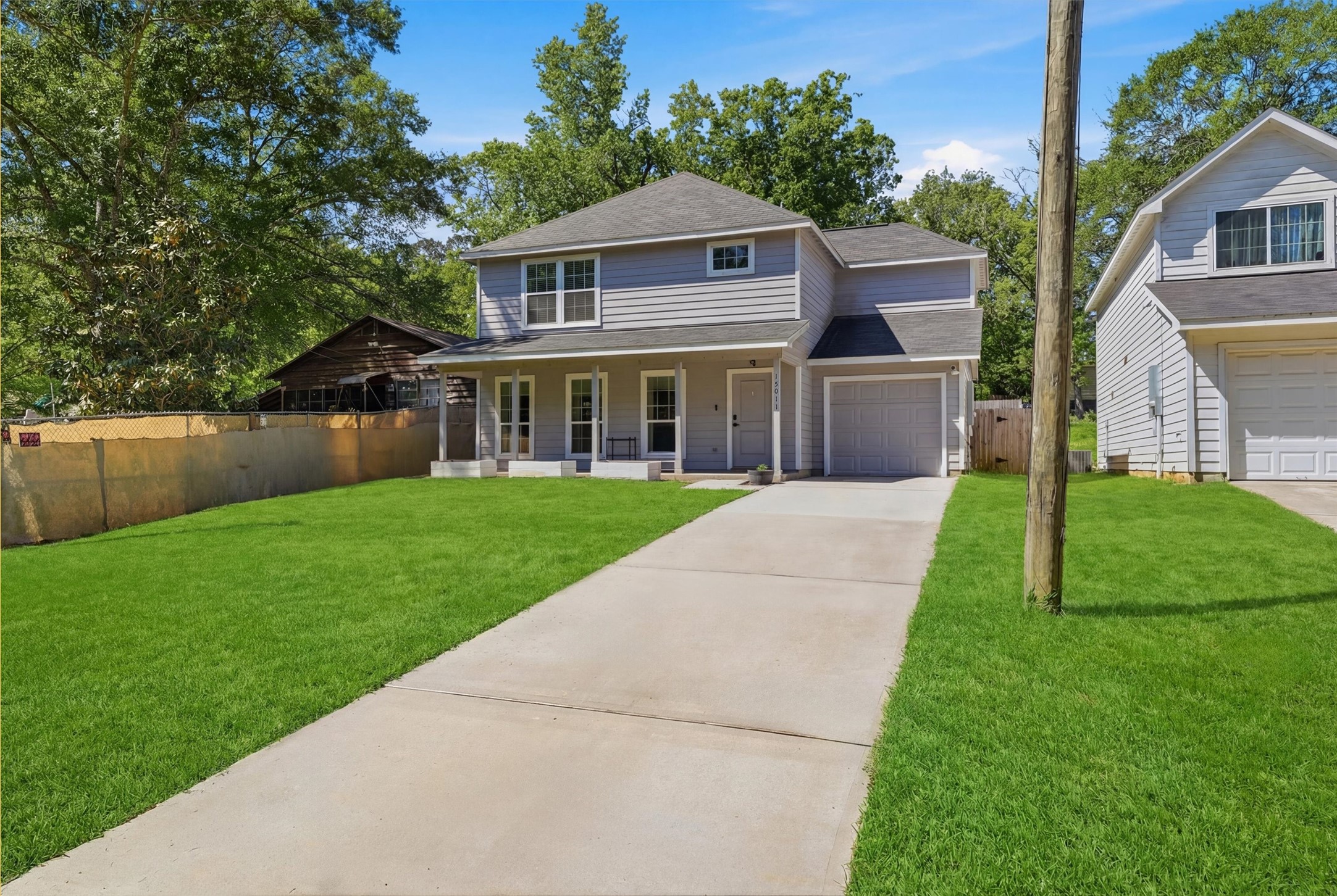 15011 Crockett Road Willis, TX 77378 - Photo 18 of 24 Curb appeal with clean, modern exterior and spacious driveway.