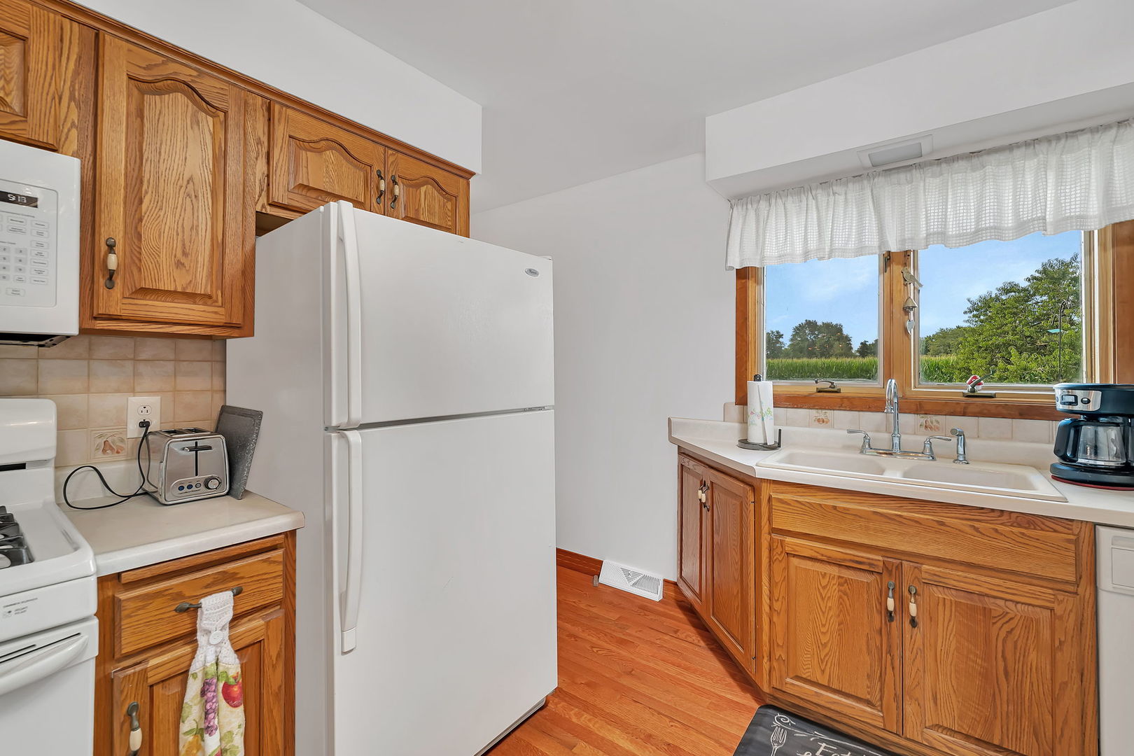 1413 Sharon Road Streator, IL 61364 - Photo 12 of 32 a white refrigerator freezer sitting inside of a kitchen