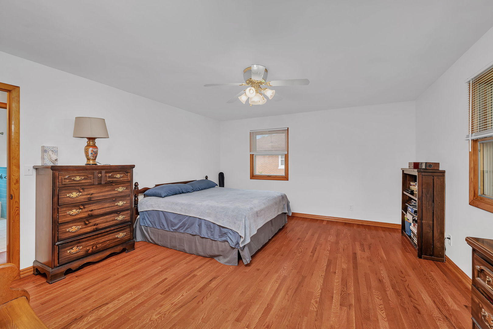 1413 Sharon Road Streator, IL 61364 - Photo 17 of 32 a bedroom with a bed and wooden floor