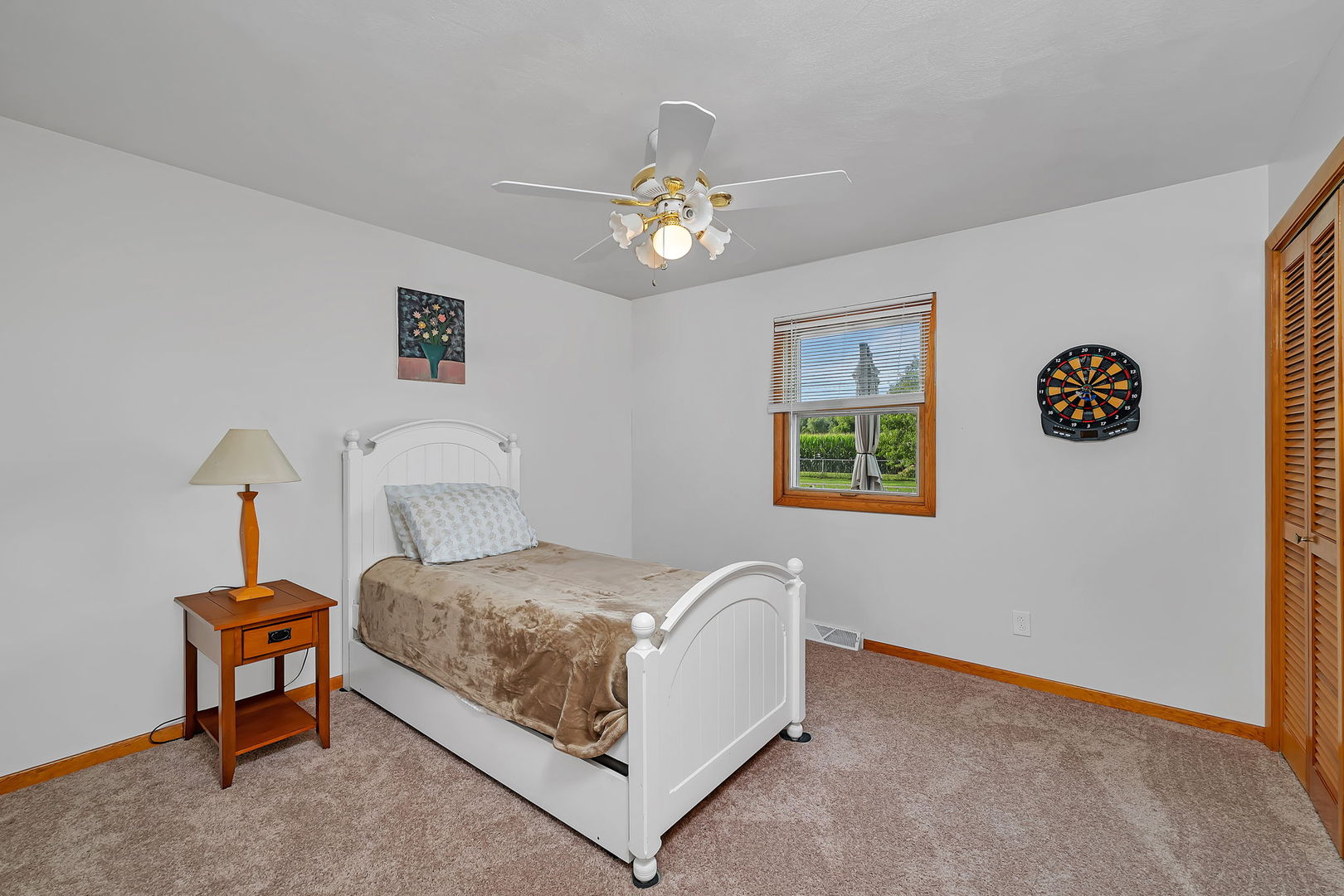 1413 Sharon Road Streator, IL 61364 - Photo 19 of 32 a bedroom with a bed and a chandelier