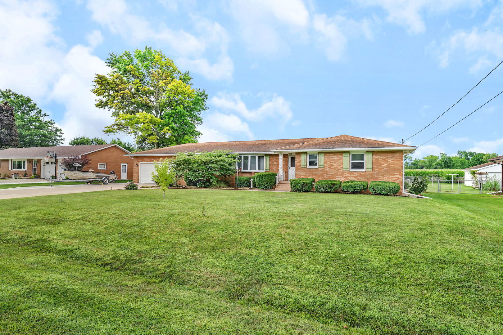 1413 Sharon Road Streator, IL 61364 - Photo 2 of 32 a front view of a house with a yard