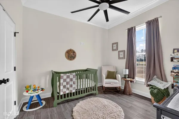 a bedroom with furniture and a window